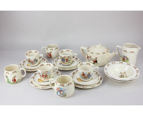 A collection of Royal Doulton Bunnykins porcelain breakfast ware comprising teapot, milk jug, two bowls, three mugs, four tea