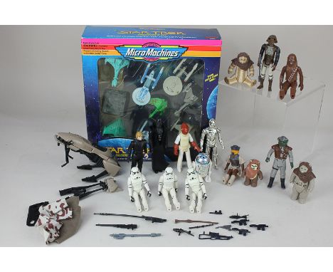 A collection of Lucas Films 1980's Star Wars toy figures, unboxed, together with a boxed Micro Machines Star Trek Collector's