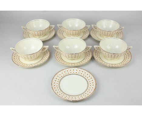 An Art Deco Wedgwood porcelain part soup set comprising six two-handled bowls, six saucers and a plate