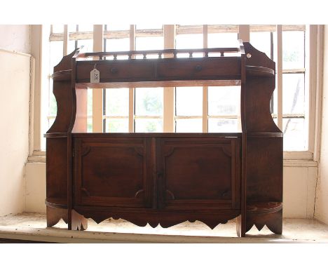 A Victorian wall shelf cabinet with two drawers and balustrade, panelled cupboards and side shelves, 87cm