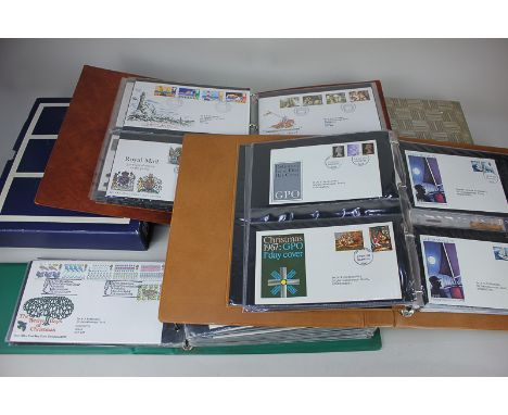 An Introplast album of British stamps, together with four albums of first day covers and some loose