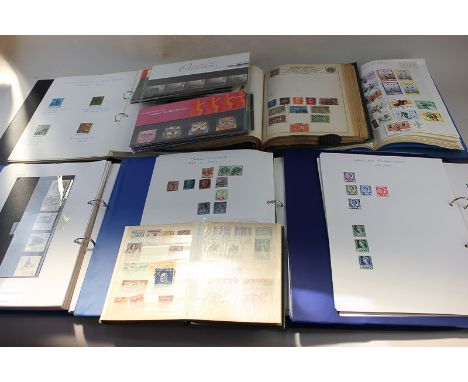 A collection of Victorian and later British and world stamps in twelve albums, including a penny red and two penny blue, post