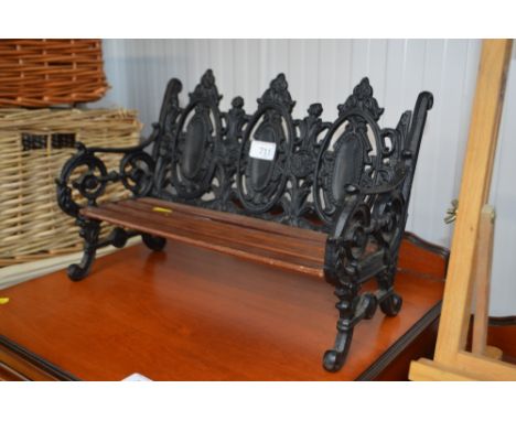 An ornate miniature garden bench 