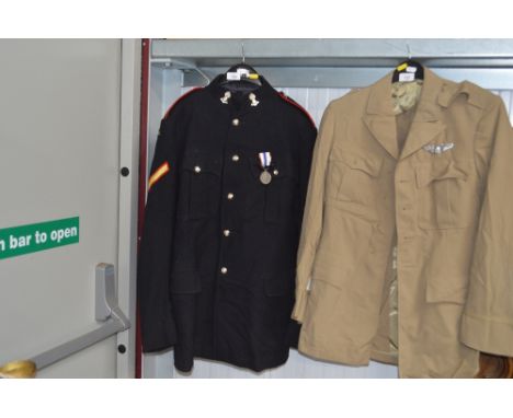 A British Army uniform including trousers and medal