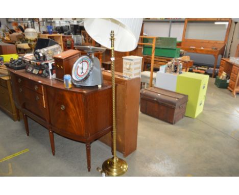 A brass standard lamp and shade