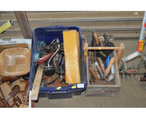 A plastic tub and a wooden trug of various hand tools 
