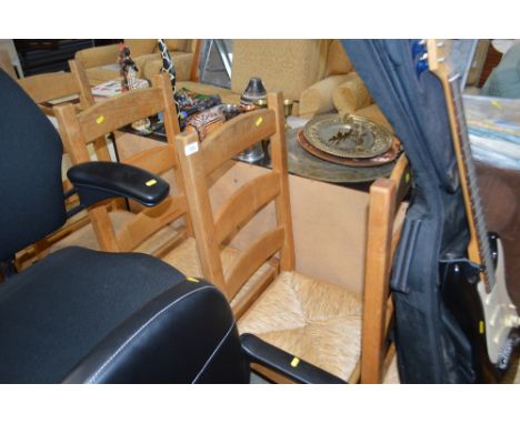 A set of eight beech ladder back dining chairs 