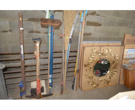 Four bundles of various long handled garden tools