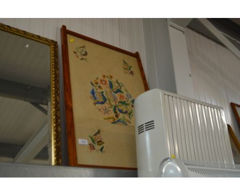 An oak framed tapestry depicting flowers 