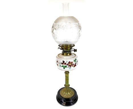 A late 19thC oil lamp, with clear and frosted glass shade, clear funnel and glass reservoir, on a turned brass stem and inver
