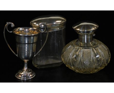 A George V silver two handled golf trophy, London 1935, (AF), 1.70oz, a cut glass scent bottle with silver hinged cap and mou