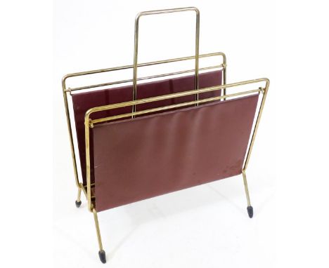 A vintage newspaper rack, with burgundy leatherette section and metal mounts with central handle, 37cm W.