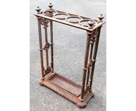 A 19thC cast iron stick stand, in the manner of Coalbrookdale, of rectangular form, with four circular sections, and lower li