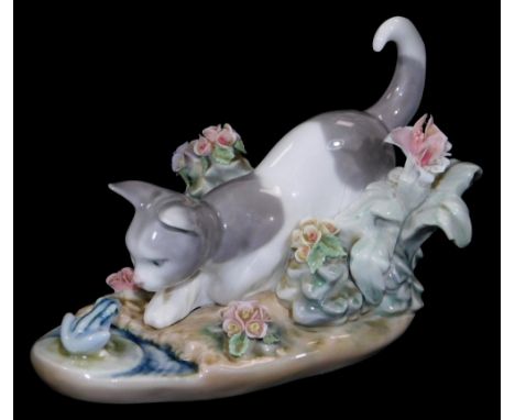 A Lladro figure group of kitten and frog, printed marks beneath, 10cm H.