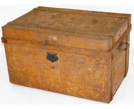 An early 20thC tin trunk, of rectangular form, with studded top and side handles, 48cm H, 77cm W, 51cm D.