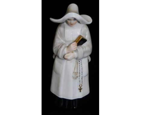 A Royal Worcester candle snuffer, modelled in the form of a nun, printed mark in puce to underside, 9cm H.