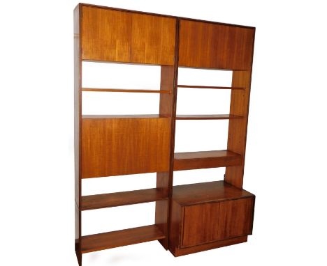 Two vintage G-Plan teak cabinets, each with upper double door cupboards above open shelves, one with a secretaire beneath, wi