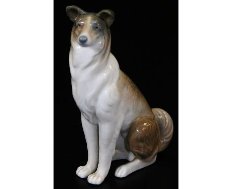 A Lladro figure of a seated collie, printed marks beneath, 14cm H.