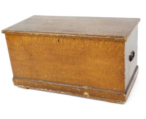 A 19thC painted pine tool chest, of rectangular form with metal side handles, on castors, 53cm H, 100cm W, 49cm D.