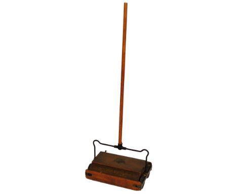 A vintage Ewbank Empire push vacuum, with wooden handle and metal mounts, 106cm H.