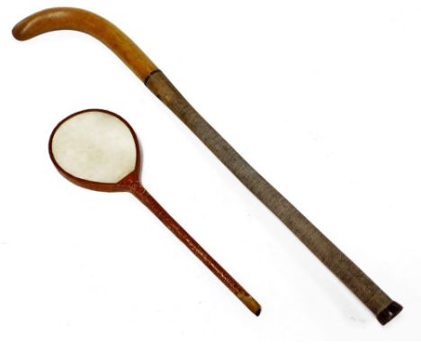 A Vintage Slazenger hockey stick, marked English Ash, with turned handle, 97cm L and a warranted Best Vellum sports racket.