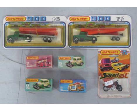 Seven Matchbox Diecast Model Vehicles comprising of #TP-25 Articulated Pipe Trailer Lorry (2), 1-75 Superfast Series #18 Hond