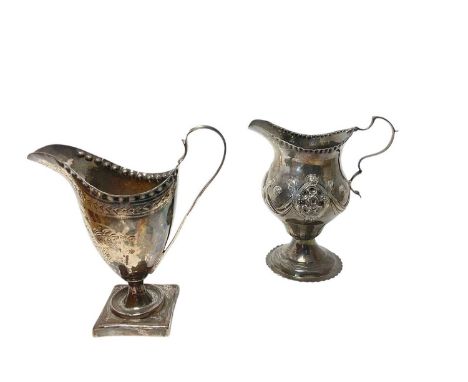 George III silver milk / cream jug of helmet form with brite cut engraved decoration, raised on a square pedestal foot, (Lond
