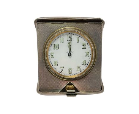 1940s silver cased travelling desk clock, with eight day movement, in folding silver case, with engine turned decoration (Bir