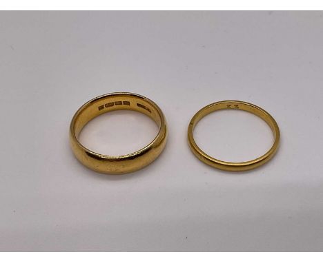 22ct gold wedding ring and a yellow metal wedding ring (2)The 22ct hallmarked ring weighs 8.1g.The other ring weighs 2.2g.