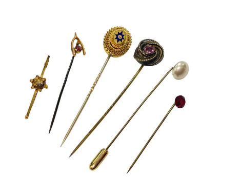 Group of gilt metal stick pins, 9ct gold horseshoe stick pin and a gold bar brooch 9ct gold horseshoe stick pin is on a metal