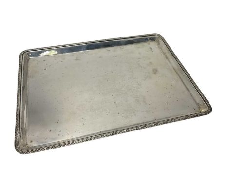 Late Victorian silver rectangular tray with decorative border, (London 1900), makers mark rubbed, 33.4cm in length, 22ozs.