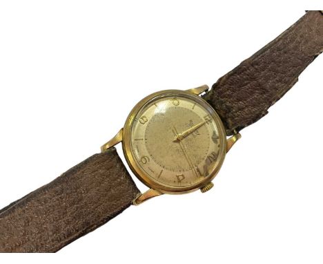 1950s 9ct gold Rotary wristwatch, case measuring 32mm diamater, on leather strap (London 1957)Back of case weighs 5.1 grams T