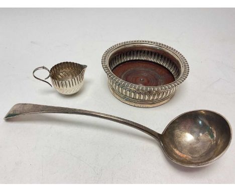 Georgian silver wine coaster (London 1813), 15.5cm diamater, Victoiran silver ladle (London 1896) and small silver cream jug 
