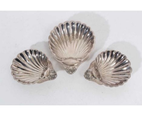 Trio of Elizabeth II silver dishes of shell form, raised on ball feet, (London 1972, 1973 &amp; 1975), maker A Chick &amp; So