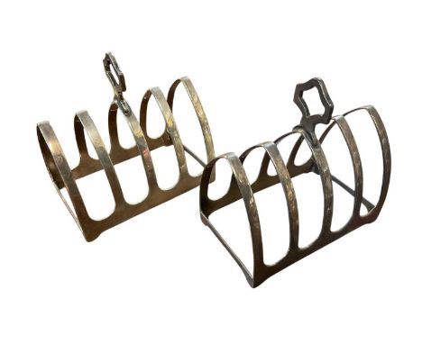 Pair of 1930s silver four division toast racks of Gothic arch form, with central carrying handles (London 1933) Sir John Benn