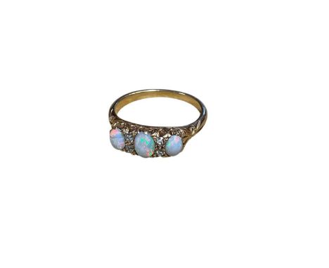 Late Victorian opal and diamond ring in gold setting, size M 1/2Weighs 4g. No hallmarks but tests as 18ct. One opal is cracke