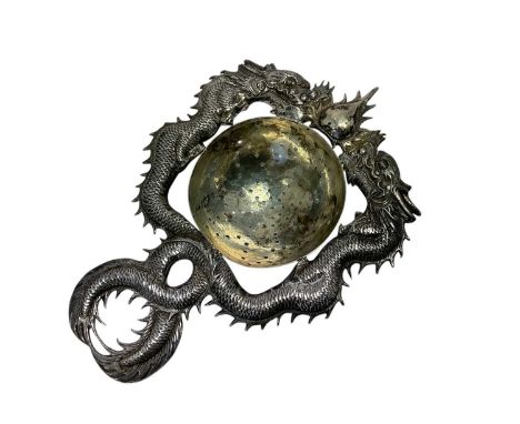 Late 19th / early 20th century Chinese silver tea strainer, with dragon decoration. Chinese character mark, 90 WH (Wang Hing)