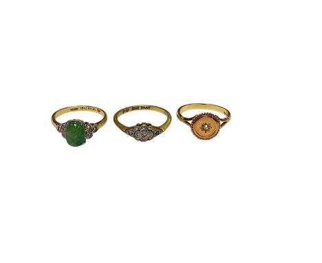 Three Victorian and later 18ct gold rings to include a jade/green hardstone cabochon and diamond ring, size L½, diamond clust