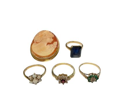 Four 9ct gold gem set rings and 9ct gold mounted cameo broochFour rings weigh 9.4 gramsCameo brooch weighs 4.6 grams