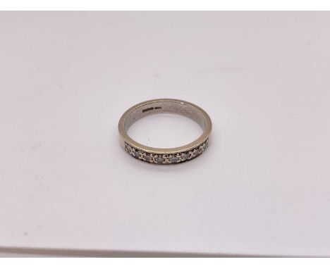 9ct white gold diamond half eternity ringSize M. Weighs 3.3g.