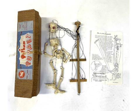 1960s - 1970s Pelham puppet formed as a skeleton in original box with original paper instructions. Crack to femur and some ag