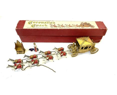 A boxed vintage die-cast Queen Elizabeth II Coronation Coach, with extra model of the Queen and a golden throne.