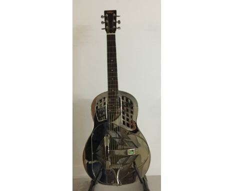 VINTAGE AMG2 RESONATOR. This weighty steel resonator guitar boasts three aluminium spun cones giving it a flexibility in tone