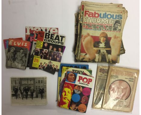 ELVIS MAGAZINE/POP/BEAT MAGAZINES. Collection of music memorabilia to include: a black and white photographic print depicting