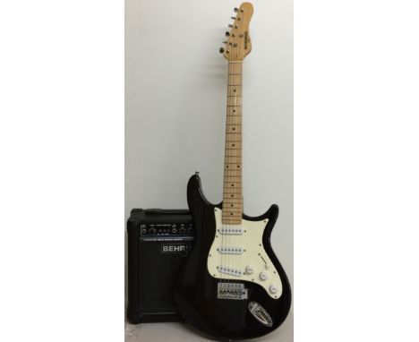 BEHRINGER V TONE GUITAR AMP COMBO. Black and white strat-style guitar from Behringer, comes with GM108 15 watt amplifier. Con