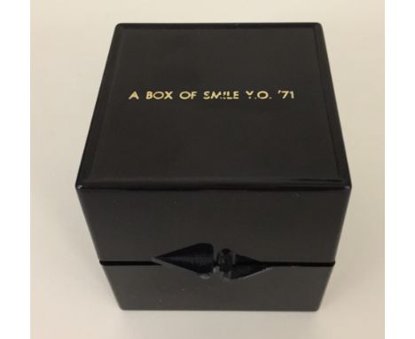 YOKO ONO - BOX OF SMILE. An original issued 'Box Of Smile' by Yoko Ono, circa 1971. Engraved black plastic box with mirror an