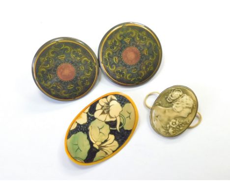 BUCKLES. Three early 20th century dress celluloid buckles, the two-part buckle with metal backing. Largest oval buckle, 8.6 x