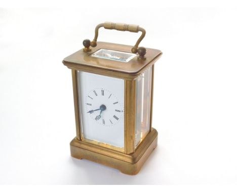 SMALL CARRIAGE CLOCK. A small brass-cased, four-glass carriage clock. No key. Height, with handle down, 7.8cm. Condition Repo