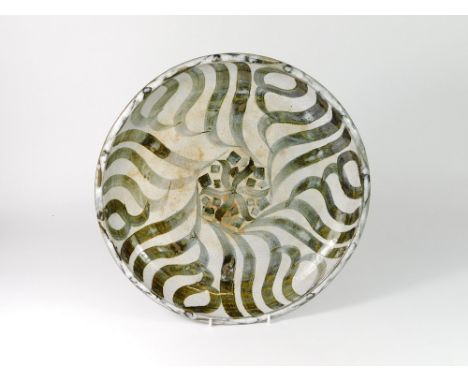 STUDIO POTTERY DISH. A large shallow, studio pottery dish with painted decoration. Unidentified impressed mark. Diameter 34cm