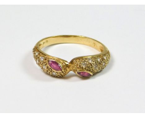 SERPENT RING. An 18ct. gold, confronting serpent ring, the top set with two ruby 'eyes' & clear stones. Size P/Q. Approx. 3.2